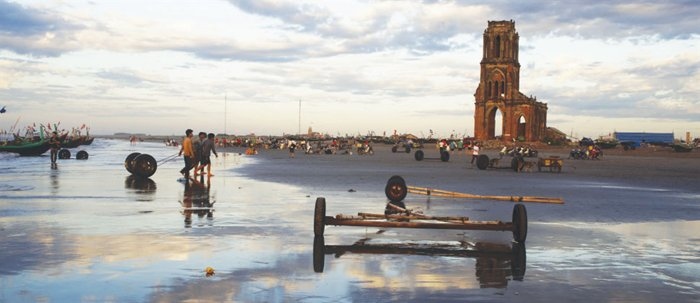 Bustling fishing activity around the ruined church in Nam Dinh