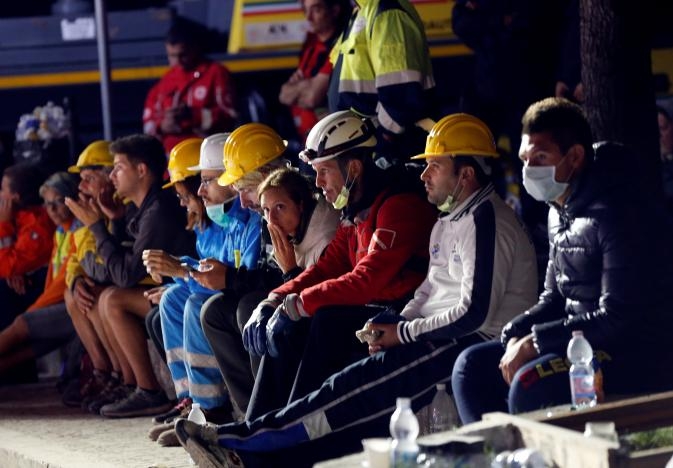 Italy rescuers toil through night seeking quake survivors as death toll hits 159