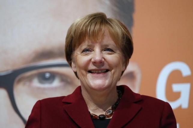 Merkel crosses fingers before German 'Super Sunday' regional polls