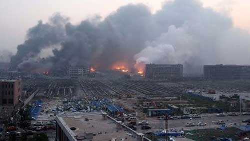 China investigates cause of blasts at Tianjin port, firms assess damage