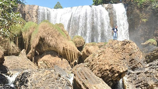 Conquering the foot of Voi Waterfall