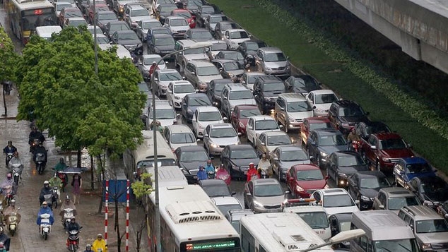 Standing water slows traffic in Hanoi