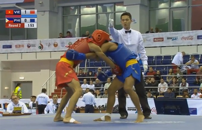 Wushu fighter finds gold after 16 years for Vietnam