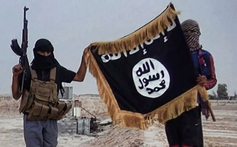 2014_10_14_militants_of_the_islamic_state_posing_with_the_jihadists_flag_rsz_crp_xjny_thfg.jpg